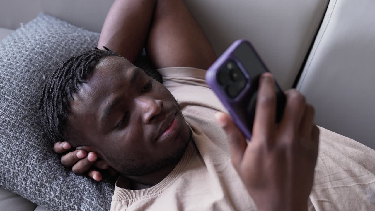 Man using phone at home