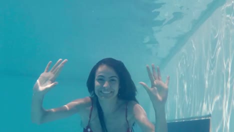 pretty woman underwater greeting