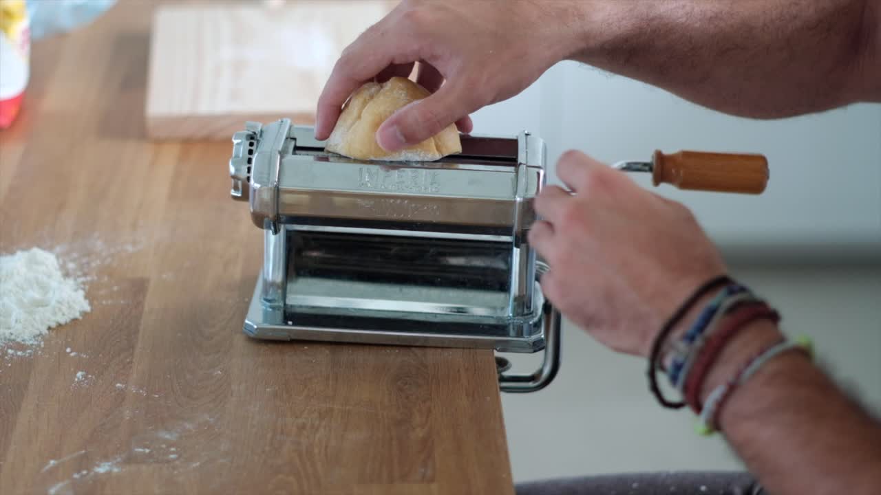 Slow Motion Pasta Symphony: Unrecognizable Man's Expertise in Making Tagliatelle - 4K Shot