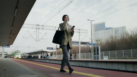 woman walking through train station