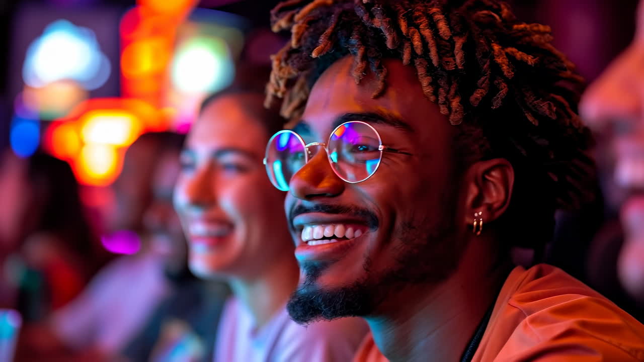 People enjoying a fun night out together. Group of friends smiles and shares laughs while enjoying a vibrant nightlife scene with colorful lights