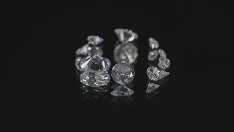 diamonds in different size and shape on mirror are spinning