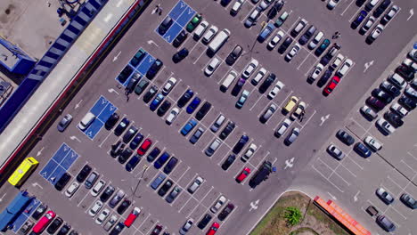 drone aerial footage top down view of a large supermarket parking lot