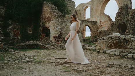 woman in wedding dress at ancient ruins