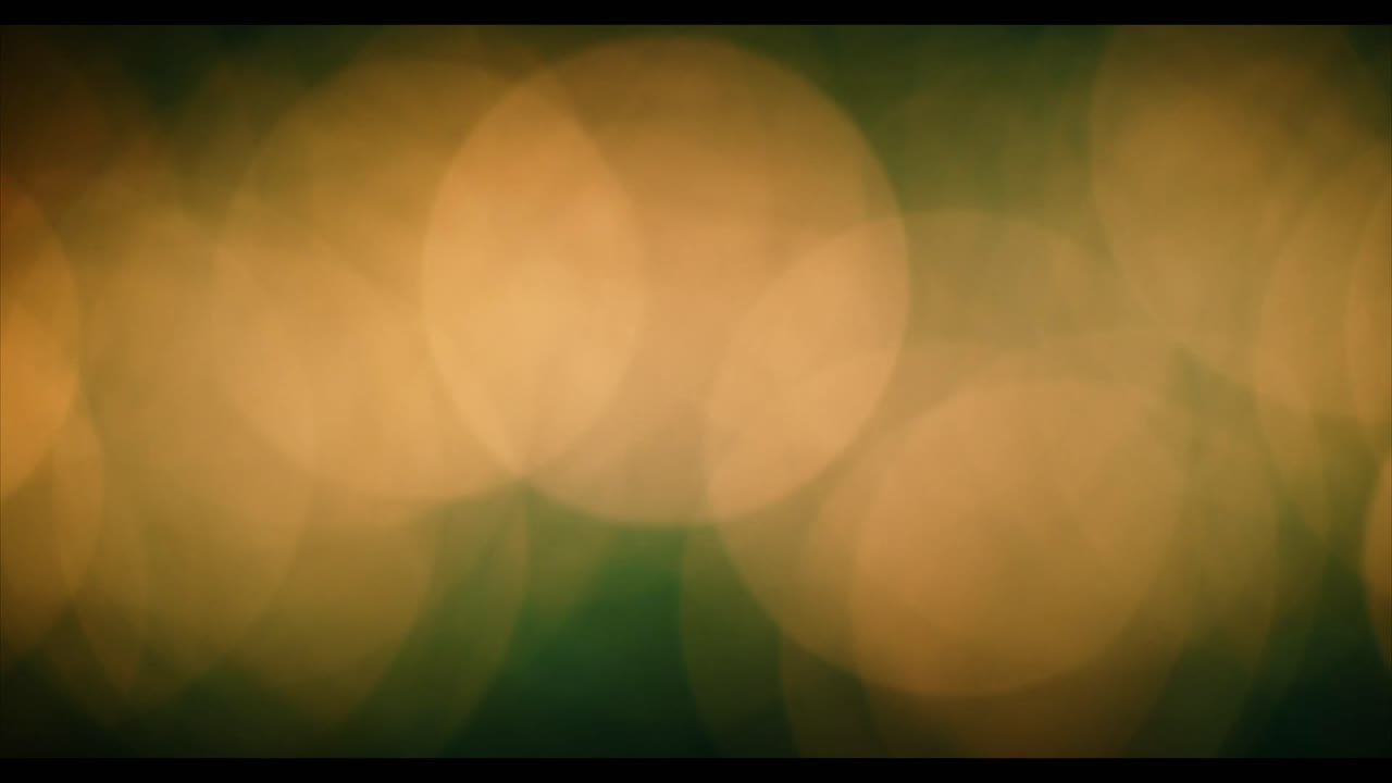 Luci Bokeh Dorate Sfocate in Movimento Astratto