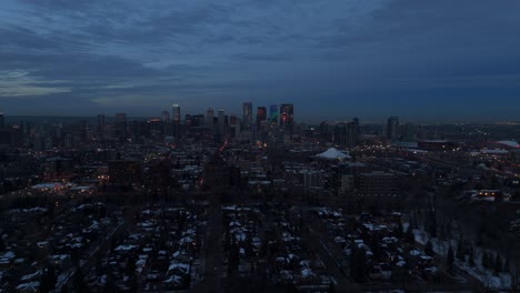 drone flight of downtown calgary during blue hour