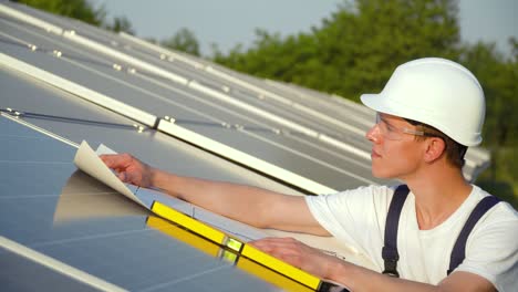 solar panel technician working with solar panels. the green energy concept