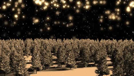 animation of glowing christmas snowflakes falling in night sky over trees in forest