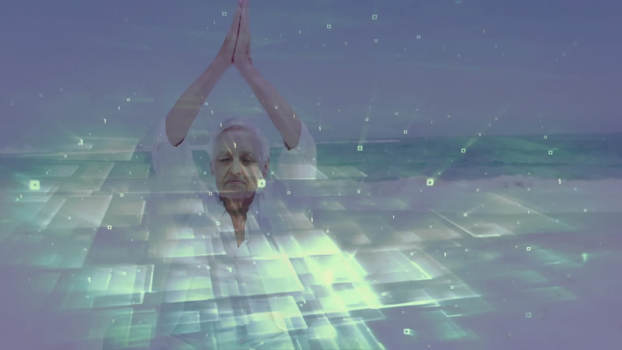 Elderly woman practicing yoga with digital data animation over ocean background