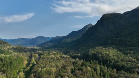 Aerial-view-of-the-green-forest-filled-valleys-of-the-Cascade-Mountains-near-Baring,-WA