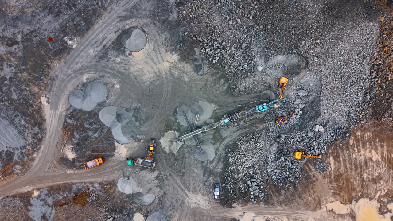 Construction site with vehicles. Heavy machinery works on a construction site. Trucks and equipment move materials and reshape the land during the day