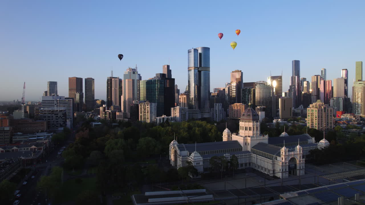 Aerial rising shot of Hot air balloons above the city of Melbourne, golden hour
