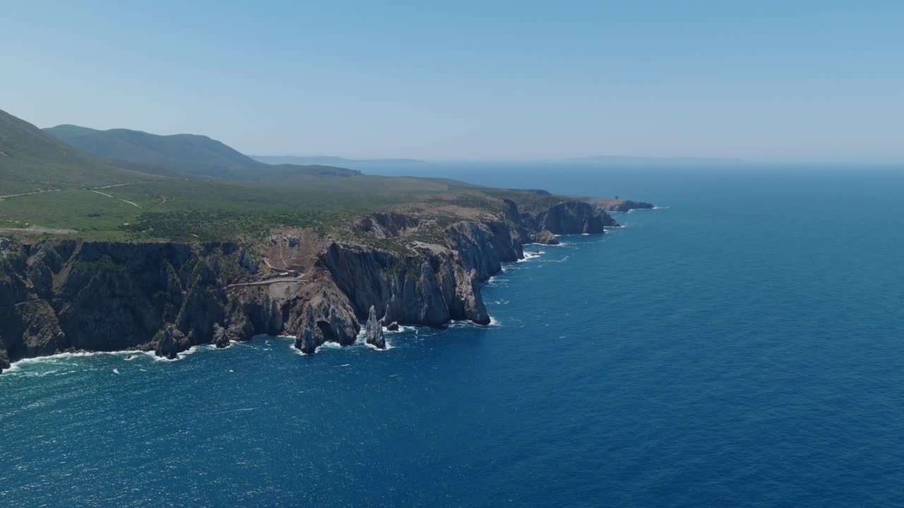 Aerial view of Sardegna's rugged coastline on a clear sunny day