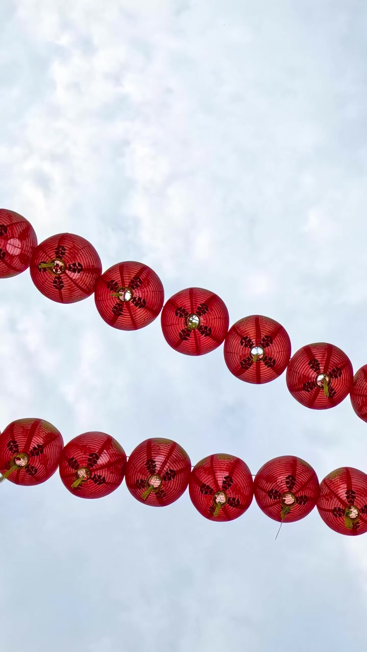Red lanterns strung between buildings in Chinatown