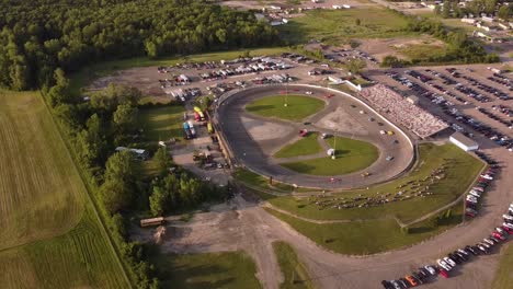 cars racing on the race track in ash township, michigan