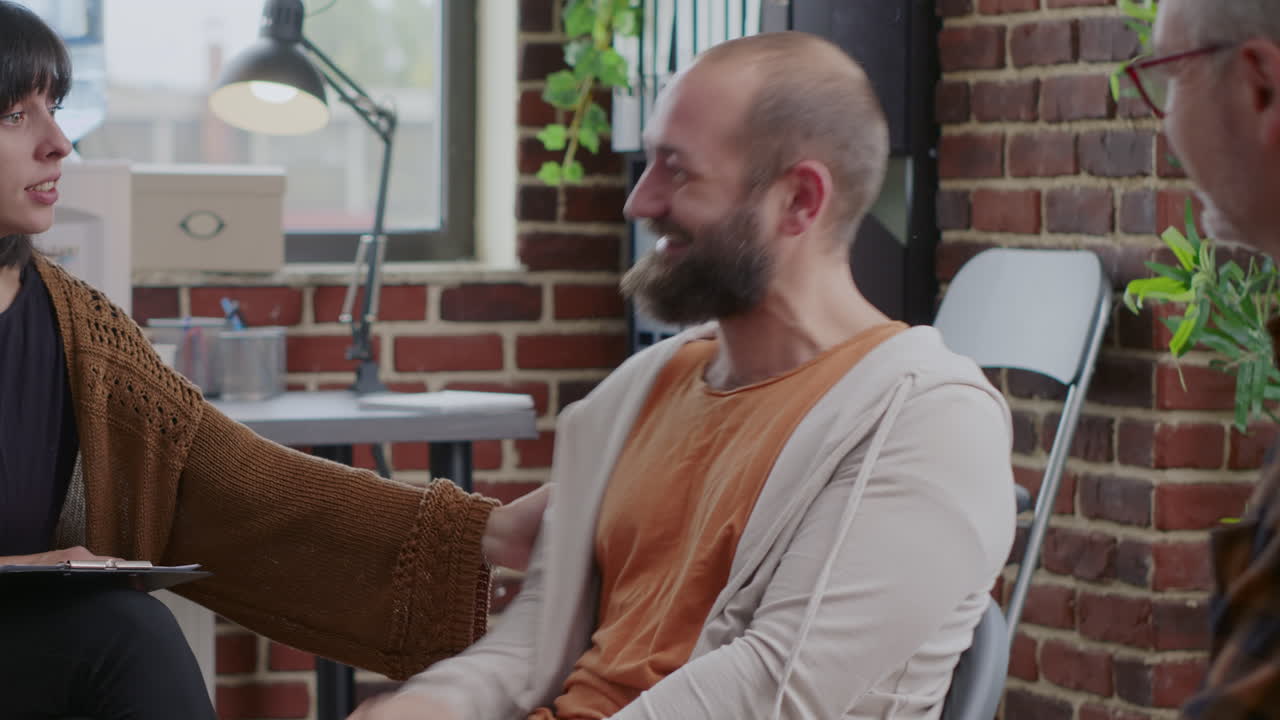 Man having nervous breakdown in front of woman at aa therapy meeting