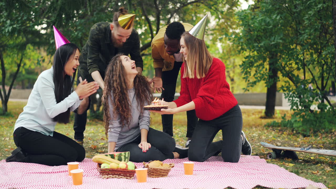 Friends Celebrating Birthday Picnic in Park