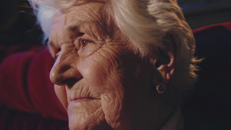 elderly woman in a theater