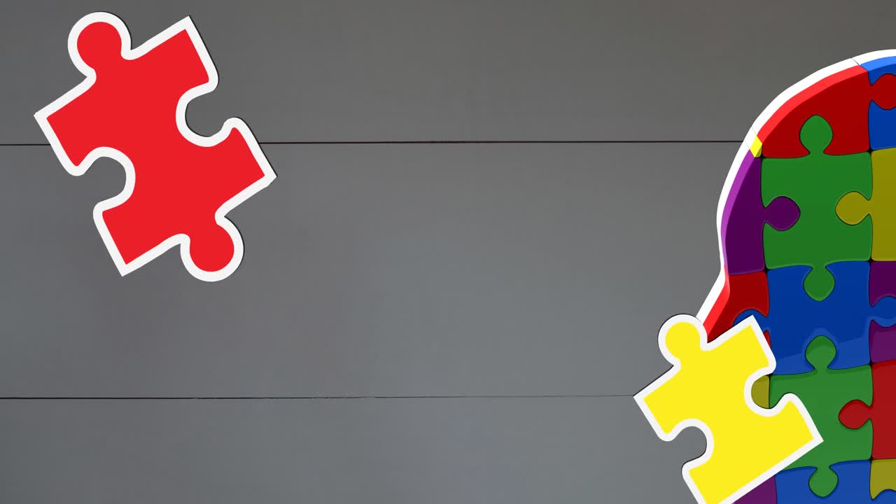 animación de piezas de rompecabezas verdes, amarillas y rojas que caen sobre el modelo de cabeza humana con rompecabezas