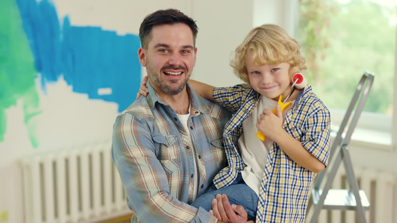 Father and Son Painting Together