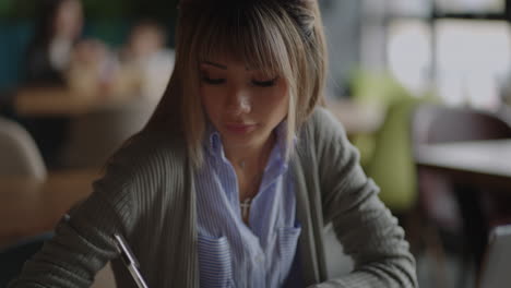 happiness attractive asian woman working with computer laptop thinking to get ideas and requirement in business startup at modern office or co-working spacebusiness startup concept