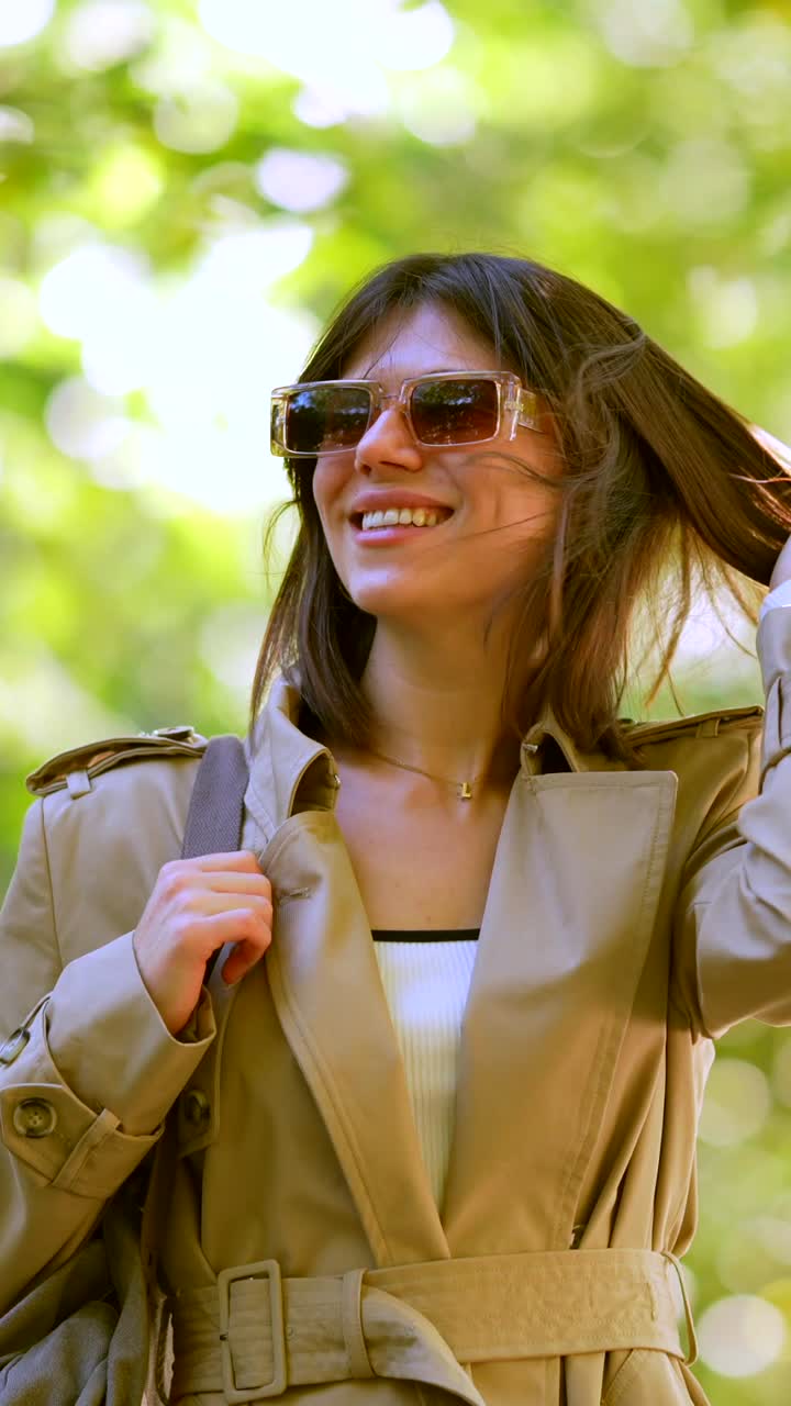 Woman in Trench Coat and Sunglasses Outdoors