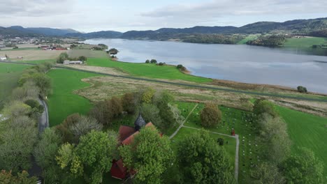 the rein church - church situated in rissa, norway - aerial drone shot