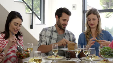 friends interacting while having a meal