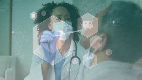animation of icons, diverse female doctor wearing mask taking sample from patient nose
