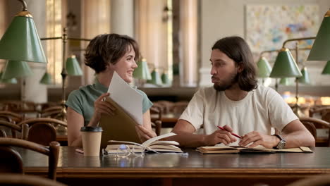 young students showing exam results to each other