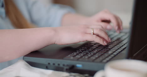 young businesswoman typing response to client email woman typing on keyboard 1