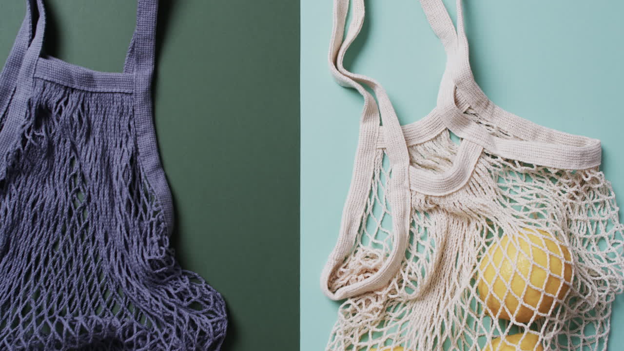 녹색과 파란색 배경에 레몬과 복사 공간을 가진 파란색과  ⁇ 색 가방의 비디오