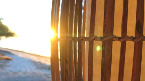 rays of sunshine going through lampion at the beach sunset in gili trawangan, bali, lombok, indonesia