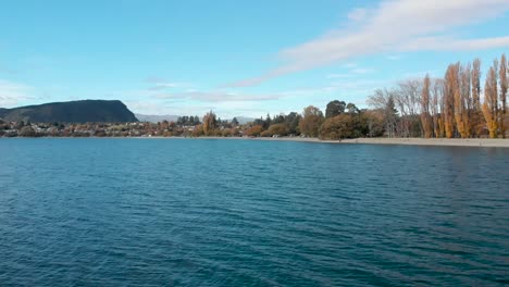 aerial drone beautiful blue lake and sky in lake wanaka, new zealand in autumn