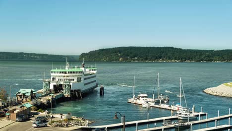 time lapse of the pt defiance vashon island ferry docking, unloading and reloading on a warm sunny summer day