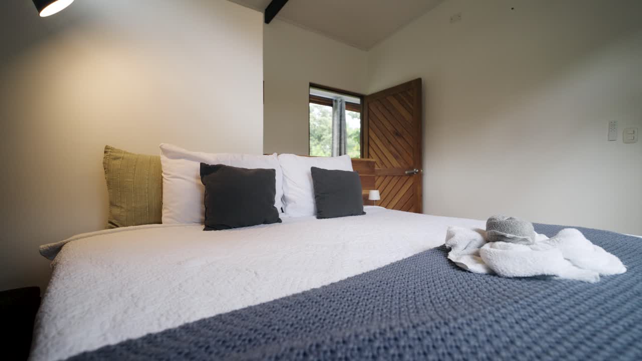Bedroom with bed and wooden door