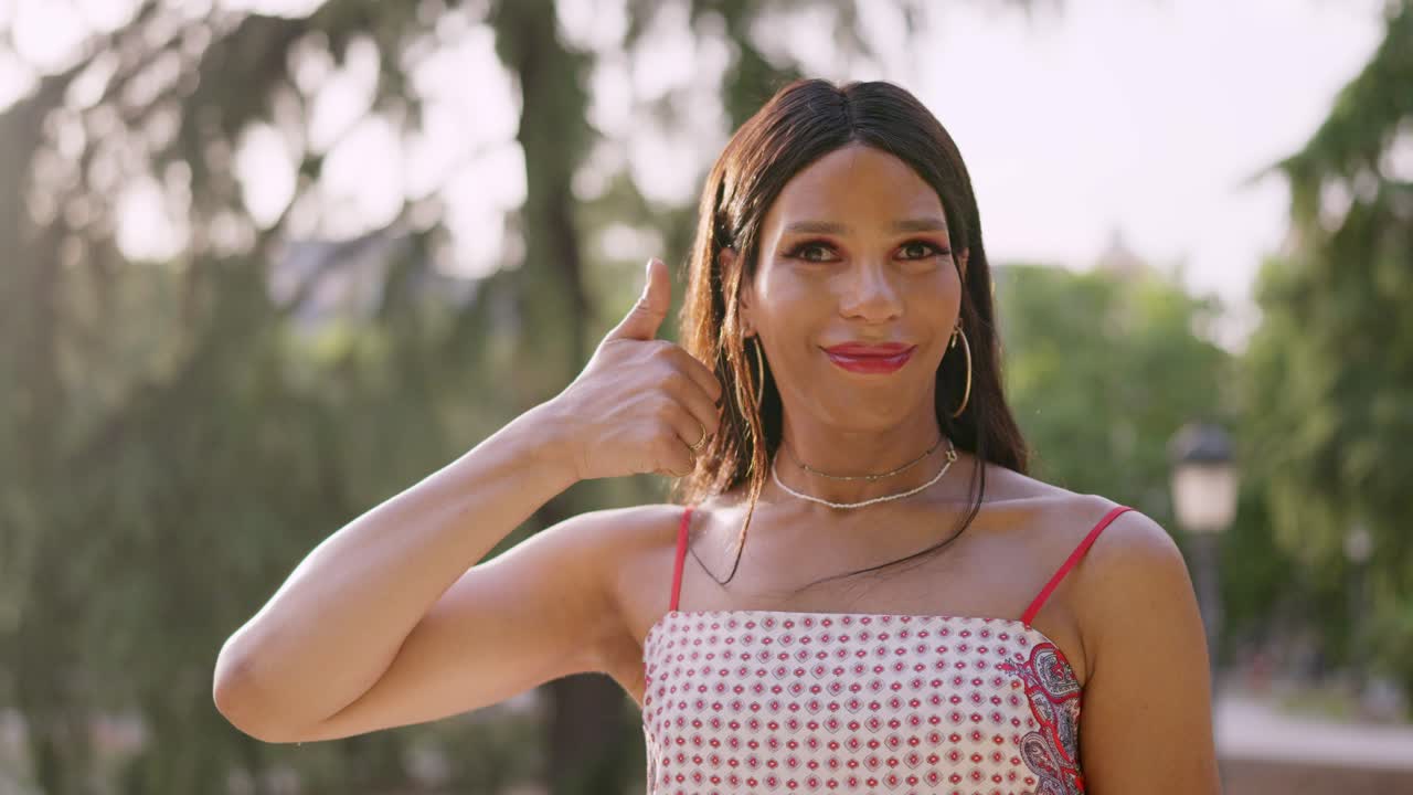 Person Giving Thumbs Up Outdoors