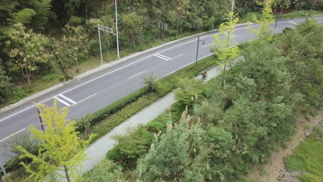 4K-Cyclist-Qiandao-Lake-Highway,-Zhejiang-Province,-China