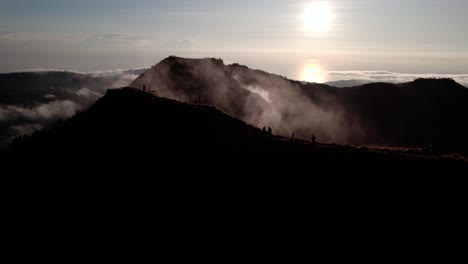 People-Walking-On-The-Mountain-Trails-During-Mount-Batur-Hike-In-Bali,-Indonesia