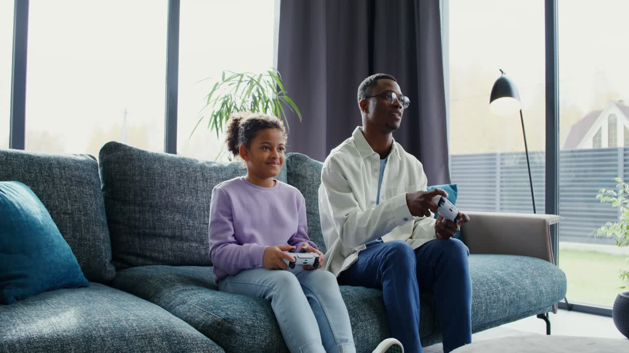 Father and Daughter Playing Video Games Together