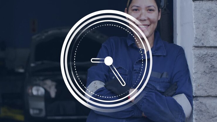 Mechanic in blue uniform smiling with clock animation overlay in workshop