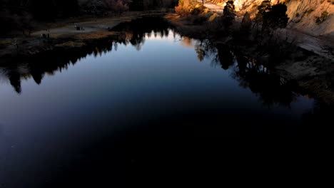 Lift-Off-from-Reflecting-Jackson-Lake,-California