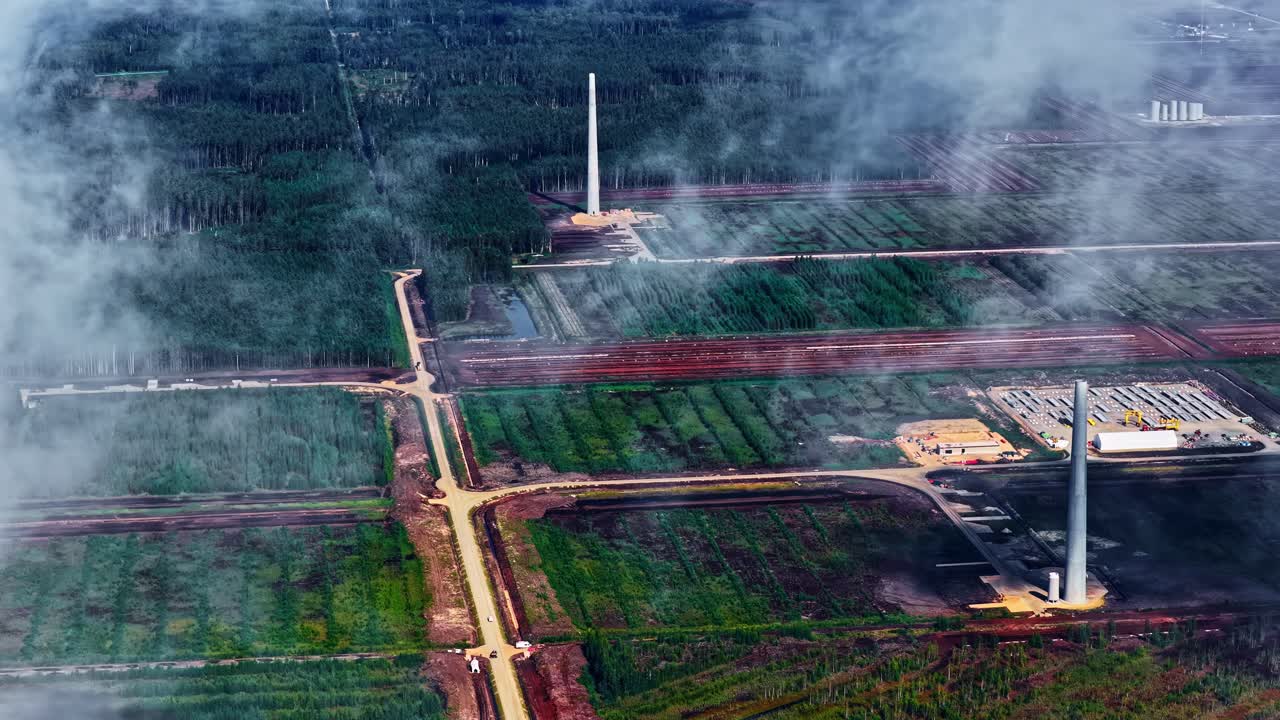 Aerial view of wind farm construction site in rural landscape, calm scenery