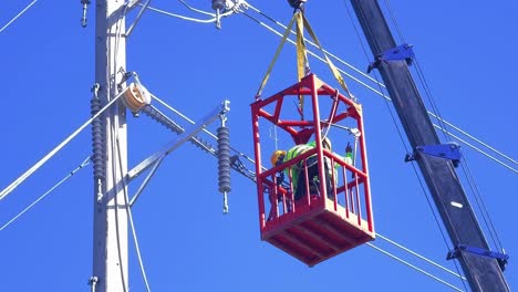 utility worker on crane platform