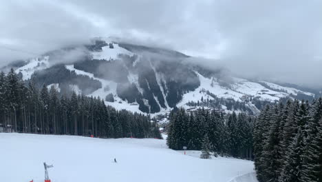 Winter-Landscaped-With-Vivid-Images-Of-Clouds-Circling-Around-The-Alps-At-The-Background-In-Austria