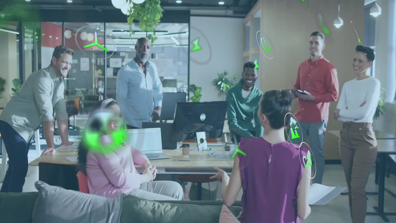 Animation of ecology icons over diverse colleagues having meeting in office