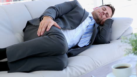 businessman sleeping on the sofa