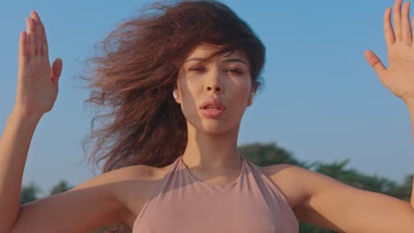 woman dancing to music outdoors