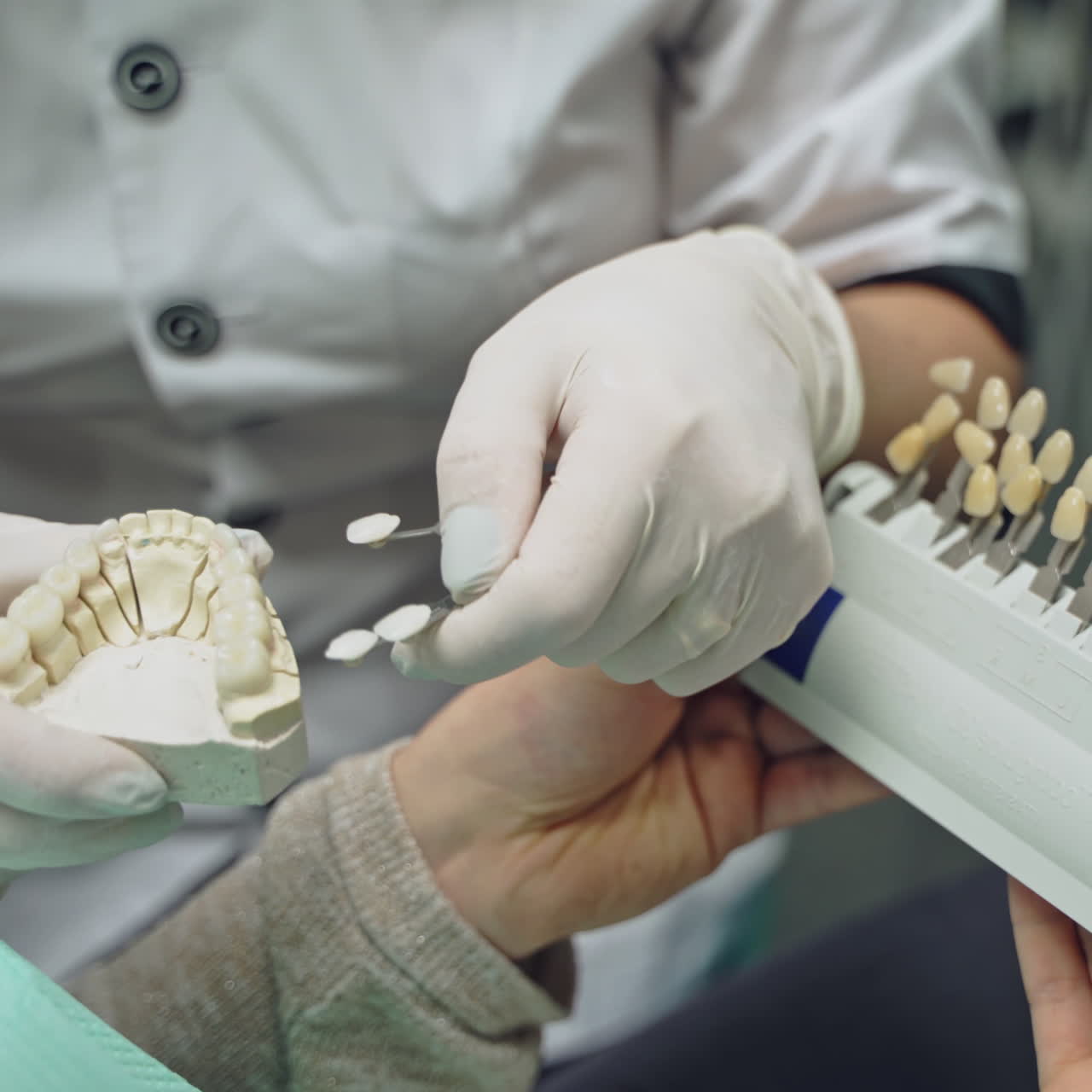 Dentist and patient in dentist office. Dental clinic.