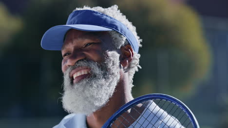 happy senior man with tennis racket